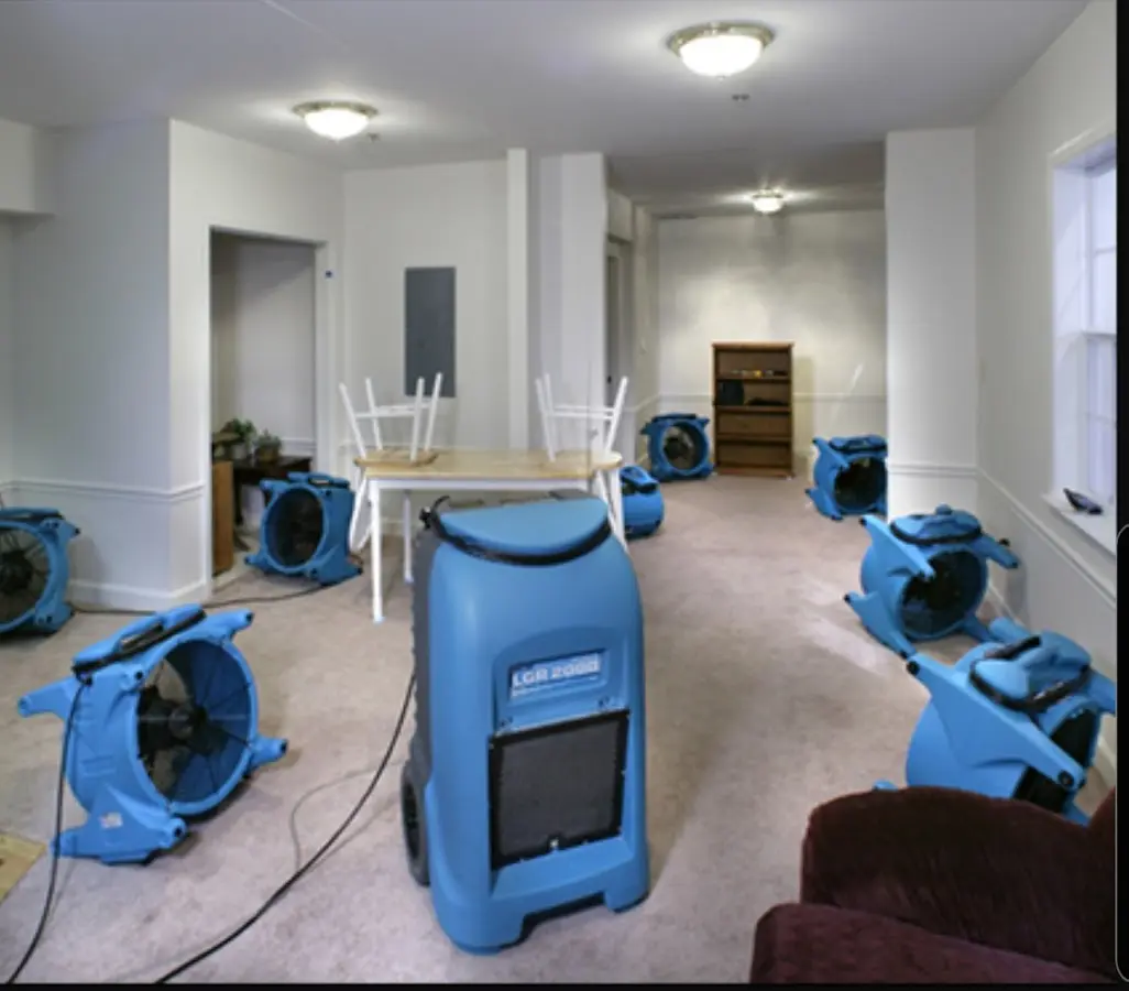Air movers and dehumidifier setup for Water Damage Restoration in Tipton